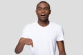 Surprised African American man with open mouth pointing finger down Royalty Free Stock Photo