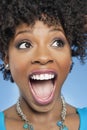 Surprised African American woman looking away with mouth open Royalty Free Stock Photo