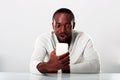 Surprised african man sitting on the table Royalty Free Stock Photo