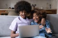 Surprised African teenagers couple staring at laptop screen Royalty Free Stock Photo