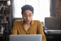 Surprised African woman gawp at laptop with mouth opened Royalty Free Stock Photo