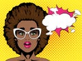 Surprised african woman with open mouth and afro hairstyle in glasses and speech bubble. Pop art retro comic style.