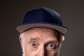 Surprised aging man wearing cap Royalty Free Stock Photo