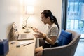 Surprised asian student getting exam results,pass exams looking excited,happy teen schoolgirl read good news while sit at work