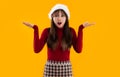 Surprised Asian woman long hair in red sweatshirt wear santa hat posing Royalty Free Stock Photo