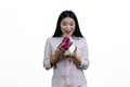 Surprised asian woman is opening a heart-shaped gift box. Royalty Free Stock Photo