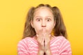 Surprised astonished girl covering mouth reaction