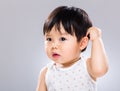 Surprised baby scratching head Royalty Free Stock Photo