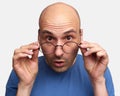 Surprised bald guy looking at camera Royalty Free Stock Photo