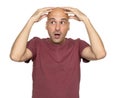 Surprised bald man holds his head in hands Royalty Free Stock Photo