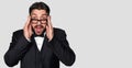 Surprised bearded man in tuxedo and eyeglasses Royalty Free Stock Photo