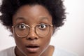 Surprised beautiful black woman with bugged eyes and opened mouth