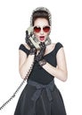 Surprised beautiful woman in pin-up style with retro telephone Royalty Free Stock Photo