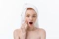 Surprised Beautiful Young Woman After Bath with A Towel On Her Head Isolated On white Background. Skin Care And Spa Royalty Free Stock Photo