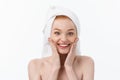 Surprised Beautiful Young Woman After Bath with A Towel On Her Head Isolated On white Background. Skin Care And Spa Royalty Free Stock Photo