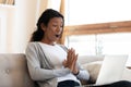 Surprised biracial woman stunned by unbelievable message on laptop Royalty Free Stock Photo