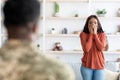 Surprised Black Wife Welcoming Soldier Husband At Home After Army