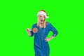 santa hat woman holding a lollipop in green screen