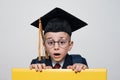 Surprised boy in glasses wearing student hat. Middle School, Junior High School