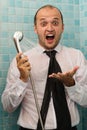 Surprised business man screaming in the shower Royalty Free Stock Photo