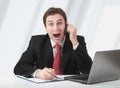 Surprised business man talking on phone Royalty Free Stock Photo