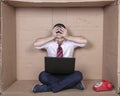 Surprised businessman reading amazing information on his laptop