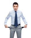 Surprised businessman showing empty pockets Royalty Free Stock Photo
