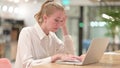 Surprised Businesswoman Feeling Shocked using Laptop