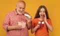 surprised child and granddad with present box for anniversary Royalty Free Stock Photo