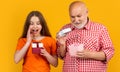 surprised child and granddad with present box for anniversary Royalty Free Stock Photo