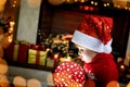 Surprised child opening Christmas gift Royalty Free Stock Photo