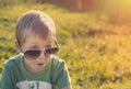 Surprised child in sunglasses