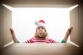 Surprised child unpack Christmas gift box Royalty Free Stock Photo