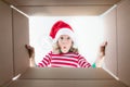 Surprised child unpack Christmas gift box Royalty Free Stock Photo