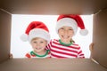 Surprised children unpack Christmas gift box Royalty Free Stock Photo