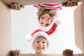 Surprised children unpack Christmas gift box Royalty Free Stock Photo