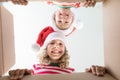 Surprised children unpack Christmas gift box Royalty Free Stock Photo