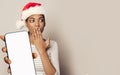 Surprised Christmas woman Santa showing smartphone with empty white screen display closeup portrait Royalty Free Stock Photo