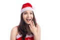 Surprised christmas woman wearing a santa hat isolated on white Royalty Free Stock Photo