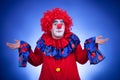 Surprised clown on blue background Royalty Free Stock Photo