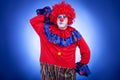 Surprised clown men on blue background Royalty Free Stock Photo