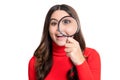 surprised curious teen girl in studio. curious teen girl with magnifying glass.