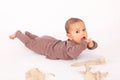 Surprised baby boy playing with paper Royalty Free Stock Photo