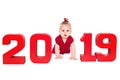 Surprised cute baby girl with red numbers 2019, isolated over white background Royalty Free Stock Photo