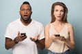Surprised diverse people feel shocked using cellphones