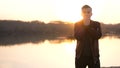 Surprised emotional man looking into the camera. Portrait of a handsome young guy on the beach during sunset Royalty Free Stock Photo