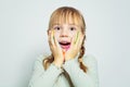 Surprised excited child girl art school student on white background portrait Royalty Free Stock Photo