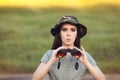 Surprised Explorer Girl with Camouflage Hat and Binoculars Royalty Free Stock Photo