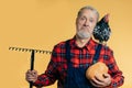 A surprised farmer holding a rake