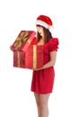 Surprised festive brunette holding a gift